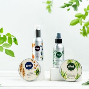 Elegant beauty product display featuring natural ingredients and greenery.