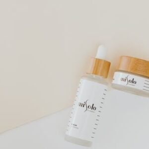 Elegant skincare products displayed in a minimalist style with bamboo lids.